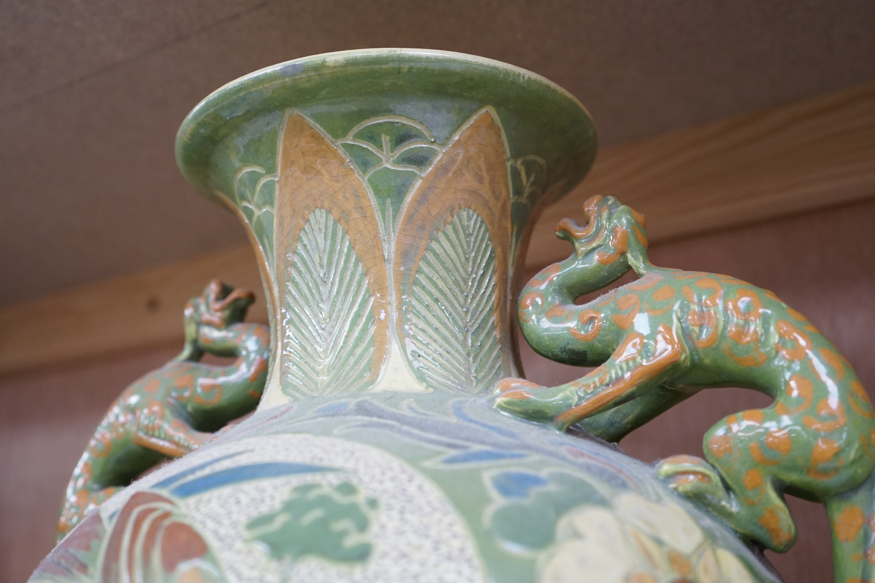 A Brannam, Barnstaple Devon, twin dragon handled vase, signed, 28cm high. Condition - fair